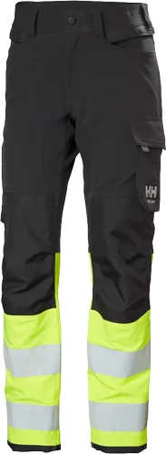 Helly Hansen 77340 Alna 4X HH Connect Varsel Byxa i svart och gul varselfärg.